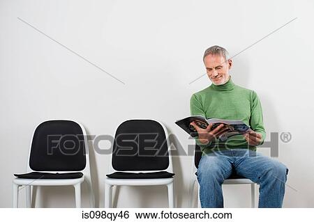 Man in waiting room View Large Photo Image Stock Photograph - Man in waiting room. Fotosearch