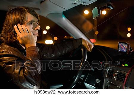 Man on cellphone in car View Large Photo Image Stock Image - Man on cellphone in car. Fotosearch