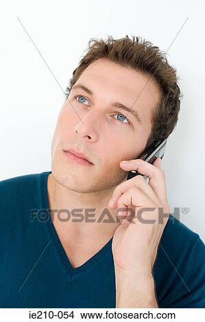 Picture - Man on cellphone. Fotosearch
