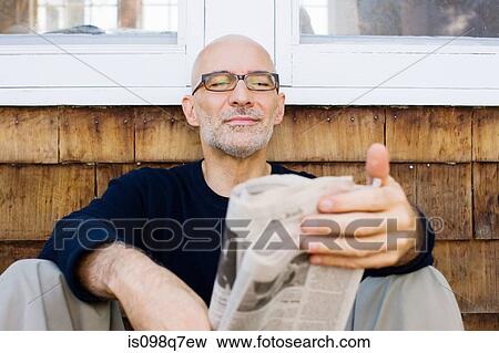 Stock Photo - Man reading newspaper. Fotosearch