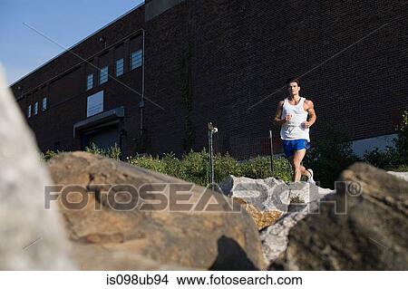Man running in city View Large Photo Image Picture - Man running in city. Fotosearch