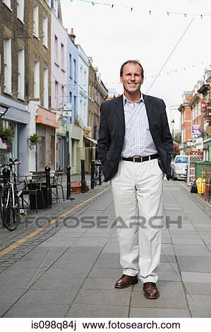 Man standing in street View Large Photo Image Stock Image - Man standing in street. Fotosearch