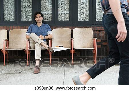 Man watching woman walk by View Large Photo Image Stock Photograph - Man watching woman walk by. Fotosearch