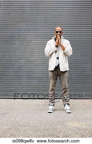 Stock Photo - Man wearing sunglasses. Fotosearch
