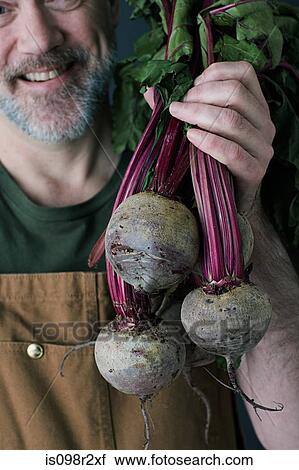 Stock Image - Man with beetroot. Fotosearch