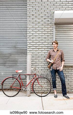 Man with bicycle View Large Photo Image Stock Image - Man with bicycle. Fotosearch