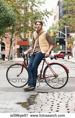 Man with bicycle View Large Photo Image Stock Photo - Man with bicycle. Fotosearch