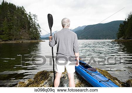 Man with kayak View Large Photo Image Stock Photography - Man with kayak. Fotosearch