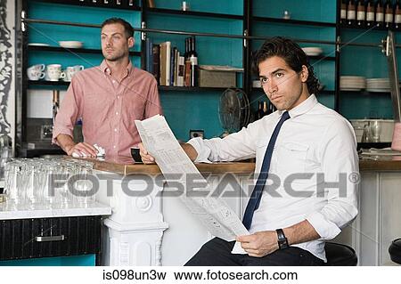 Man with newspaper and waiter in cafe View Large Photo Image Stock Photo - Man with newspaper and waiter in cafe. Fotosearch
