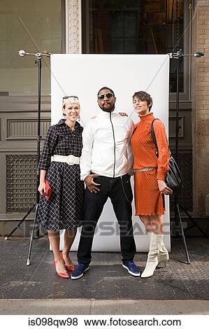 Stock Photo - Man with two women. Fotosearch