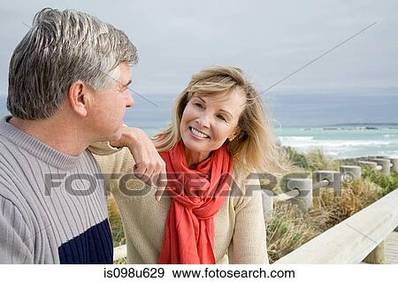 Mature couple at the coast View Large Photo Image Stock Photo - Mature couple at the coast. Fotosearch