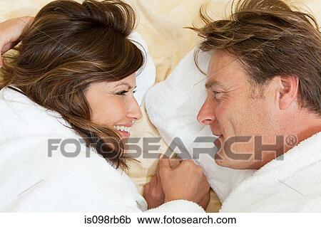 Stock Image - Mature couple in bathrobes. Fotosearch
