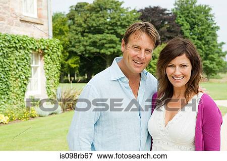 Mature couple in gardens View Large Photo Image Stock Photo - Mature couple in gardens. Fotosearch