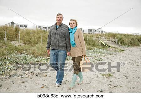 Mature couple on a beach View Large Photo Image Stock Photography - Mature couple on a beach. Fotosearch