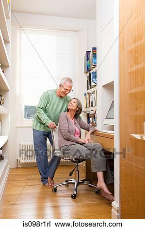 Mature couple using a computer View Large Photo Image Stock Image - Mature couple using a computer. Fotosearch
