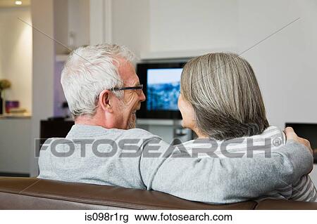Mature couple watching television View Large Photo Image Stock Image - Mature couple watching television. Fotosearch