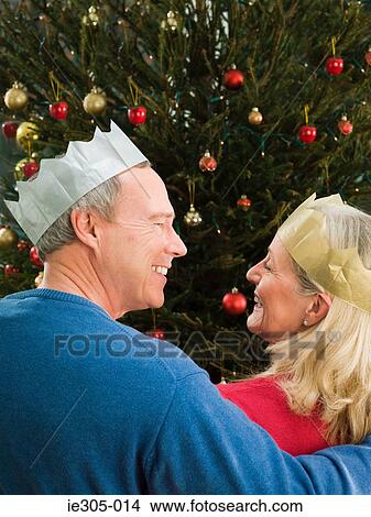Mature couple wearing party hats View Large Photo Image Picture - Mature couple wearing party hats. Fotosearch