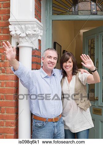 Mature man and woman waving View Large Photo Image Stock Image - Mature man and woman waving. Fotosearch