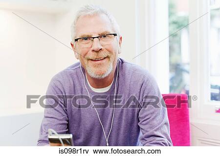 Mature man listening to mp3 player View Large Photo Image Stock Photo - Mature man listening to mp3 player. Fotosearch
