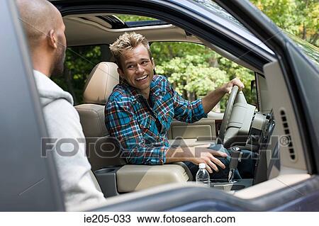 Stock Image - Men in a car. Fotosearch