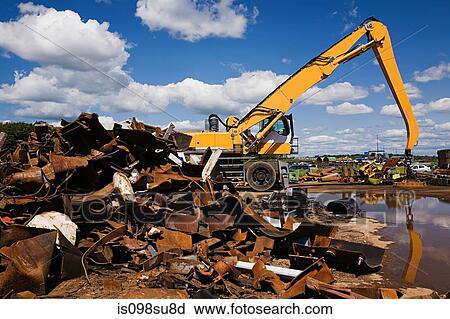 Stock Image - Metal and machine in scrap yard. Fotosearch