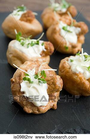 Stock Photo - Miniature toad in the hole canapes. Fotosearch