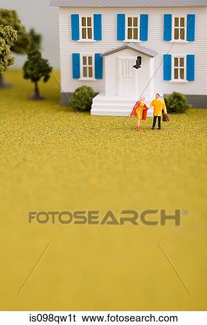 Stock Photograph - Model of couple and house. Fotosearch