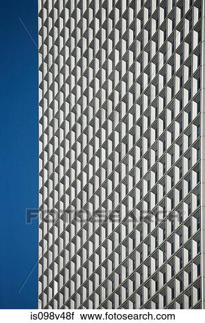 Stock Image - Modern building and windows against blue sky. Fotosearch