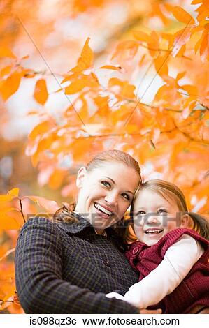 Stock Image - Mother and daughter in park. Fotosearch