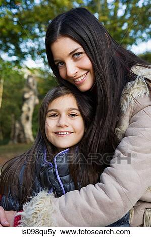 Stock Photo - Mother and daughter in park. Fotosearch