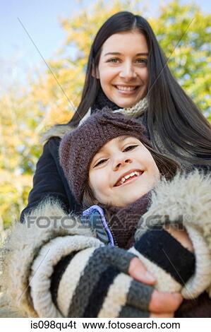 Stock Photograph - Mother and daughter in park. Fotosearch