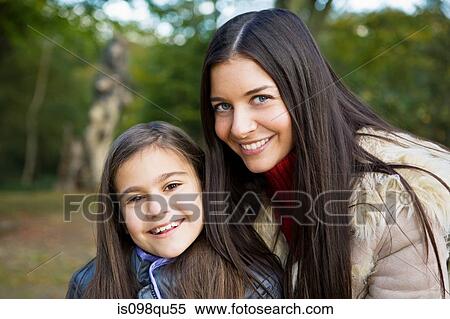 Stock Photography - Mother and daughter in park. Fotosearch
