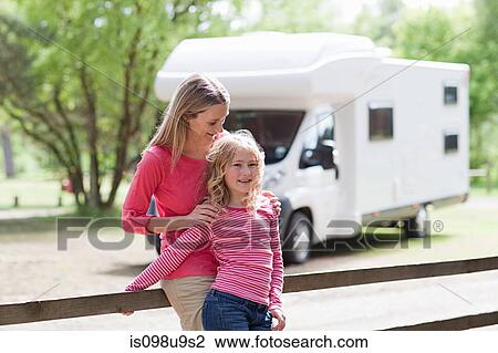 Stock Image - Mother and daughter on caravan holiday. Fotosearch