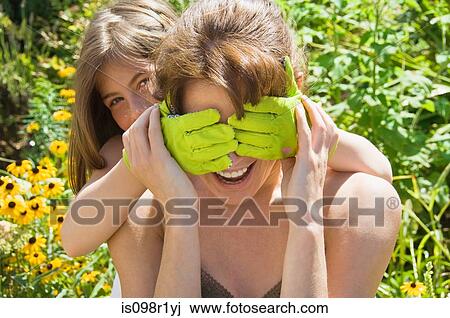 Stock Image - Mother and daughter playing. Fotosearch