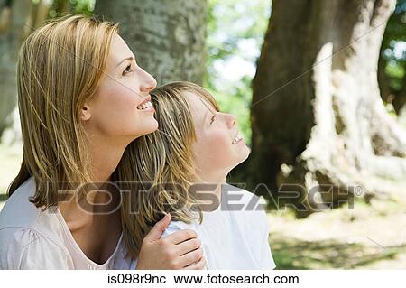 Mother and son in forest View Large Photo Image Stock Image - Mother and son in forest. Fotosearch