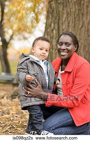 Stock Photograph - Mother and son in park. Fotosearch