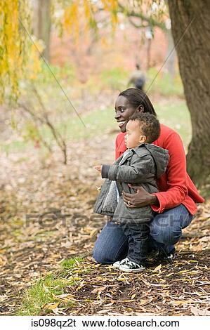 Stock Photograph - Mother and son in park. Fotosearch