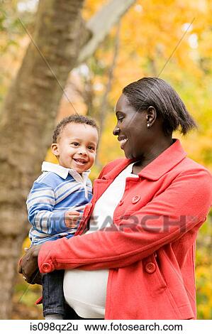 Mother and son in park View Large Photo Image Stock Photograph - Mother and son in park. Fotosearch