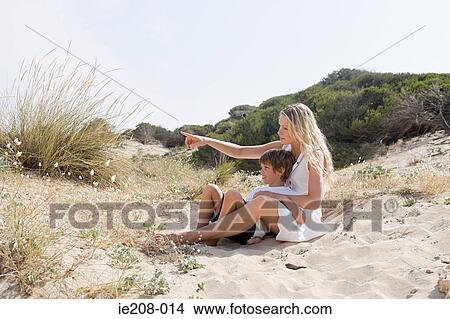 Picture - Mother and son on beach. Fotosearch