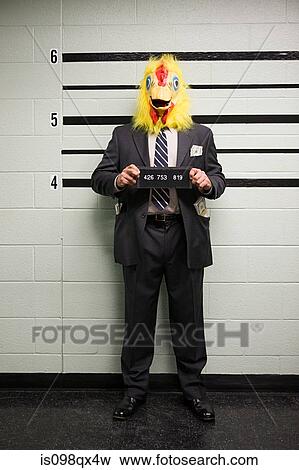 Stock Photo - Mugshot of businessman with chicken head. Fotosearch