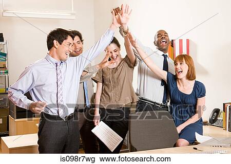 Stock Image - Office workers celebrating. Fotosearch