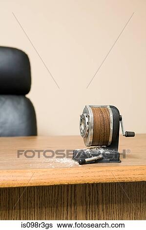 Old fashioned pencil sharpener on office desk surrounded by pencil shavings View Large Photo Image Stock Photograph - Old fashioned pencil sharpener on office desk surrounded by pencil shavings. Fotosearch
