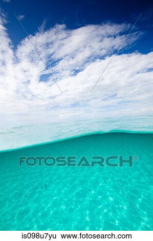 Stock Photograph - Over/under of Water and Sky. Fotosearch