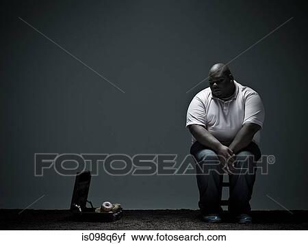 Overweight man and doughnuts in briefcase View Large Photo Image Stock Image - Overweight man and doughnuts in briefcase. Fotosearch
