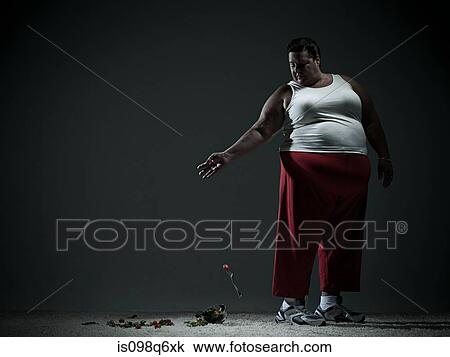 Overweight woman dropping salad View Large Photo Image Stock Image - Overweight woman dropping salad. Fotosearch