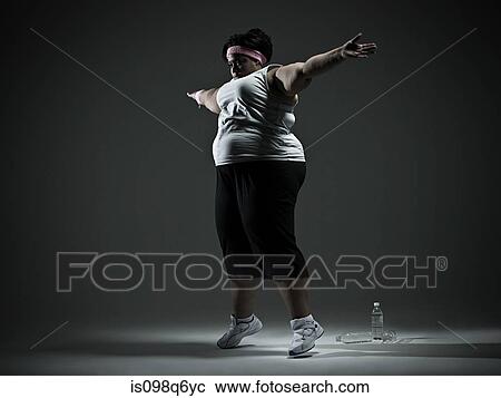 Overweight woman exercising View Large Photo Image Stock Image - Overweight woman exercising. Fotosearch