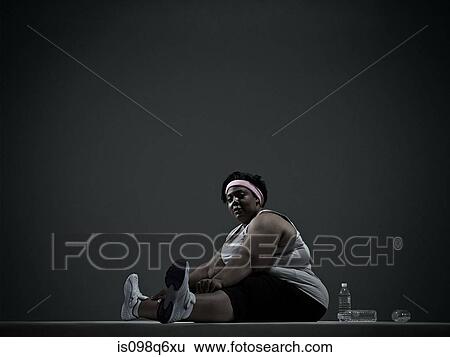 Overweight woman in sports clothing View Large Photo Image Stock Photograph - Overweight woman in sports clothing. Fotosearch