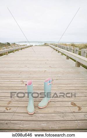 Pair of rubber boots at the coast View Large Photo Image Stock Photograph - Pair of rubber boots at the coast. Fotosearch