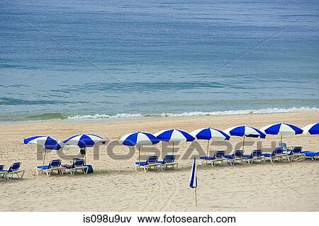 Parasols and sun loungers on beach, Montauk, Long Island View Large Photo Image Stock Photo - Parasols and sun loungers on beach, Montauk, Long Island. Fotosearch