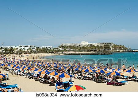 Parasols on Puerto del Carmen beach, Lanzarote View Large Photo Image Picture - Parasols on Puerto del Carmen beach, Lanzarote. Fotosearch